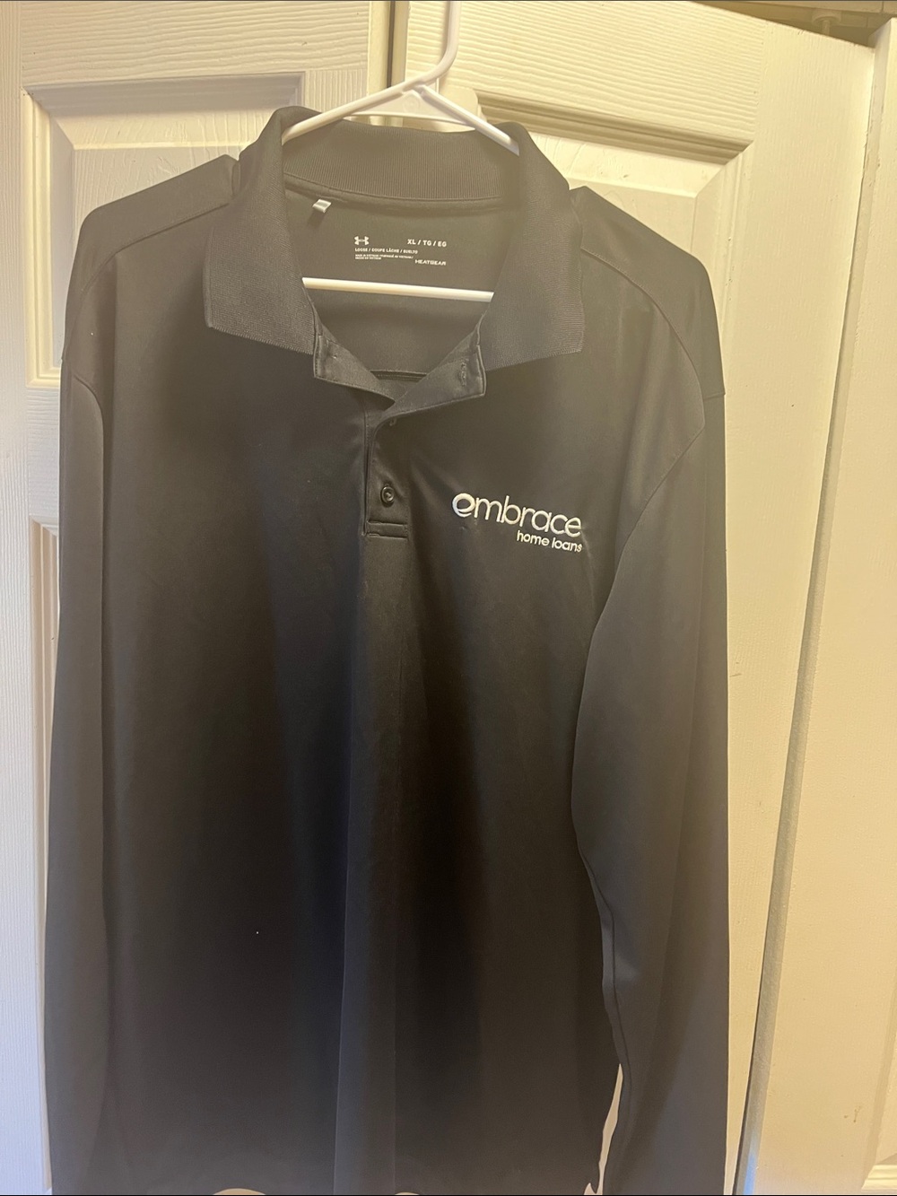 Under Armour Men's Black Long-Sleeve Polo with Embrace Home Loans Logo